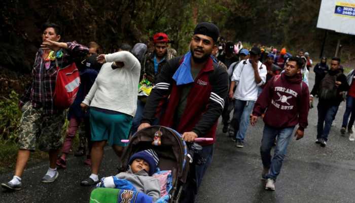 400 migrants detained after crossing under fence into US