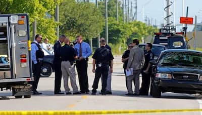 Gunman surrenders after killing five in central Florida bank- police