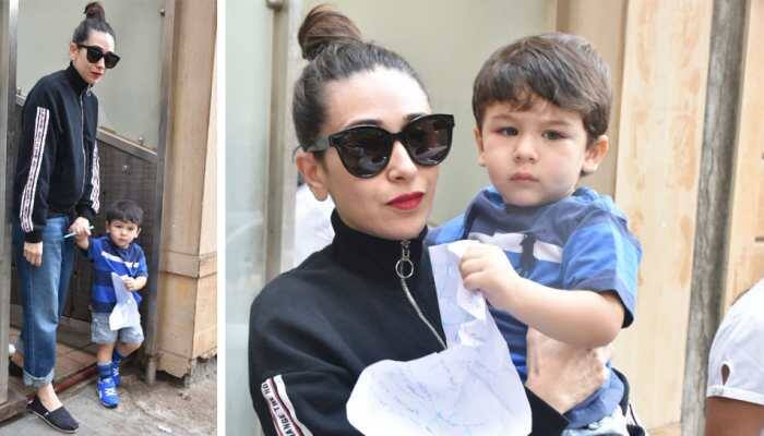 Taimur Ali Khan steps out with aunt Karisma Kapoor, plays with pen and paper - See Pics