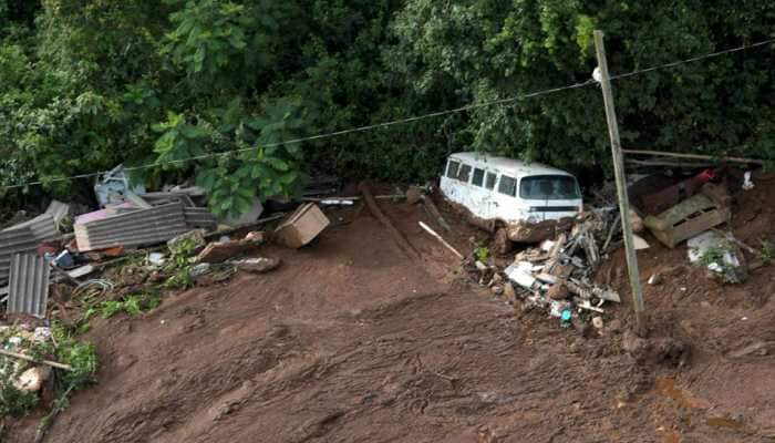 200 missing, seven bodies found after dam burst at Brazil mine