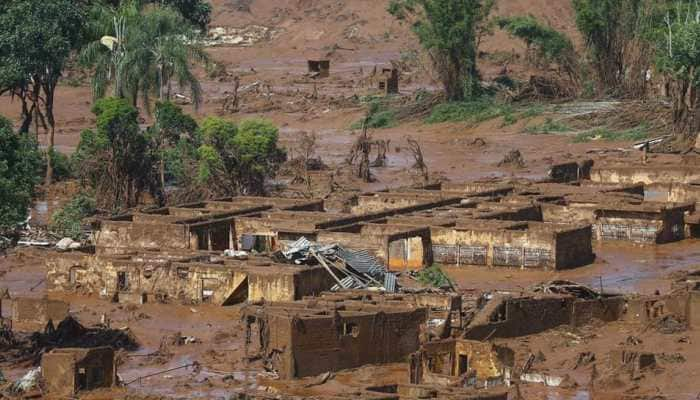 Seven bodies found after dam burst at Brazil mine, hundreds missing