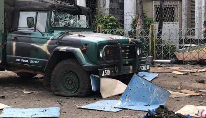Philippines vows to crush 'terrorists' after church bombs kill 20