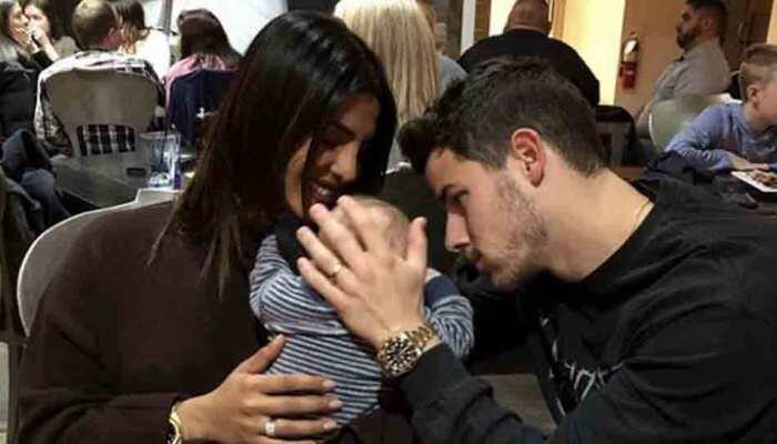 Priyanka Chopra, Nick Jonas look adorable together with a baby — Take a look