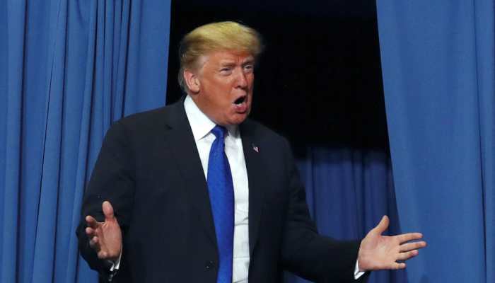 On same page with intelligence community, says Donald Trump day after advising spymasters to go back to school