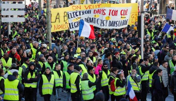 French 'yellow vests' march through Paris denouncing police violence