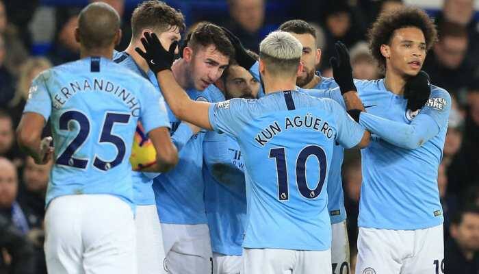 Manchester City go top of the Premier League with win at Everton