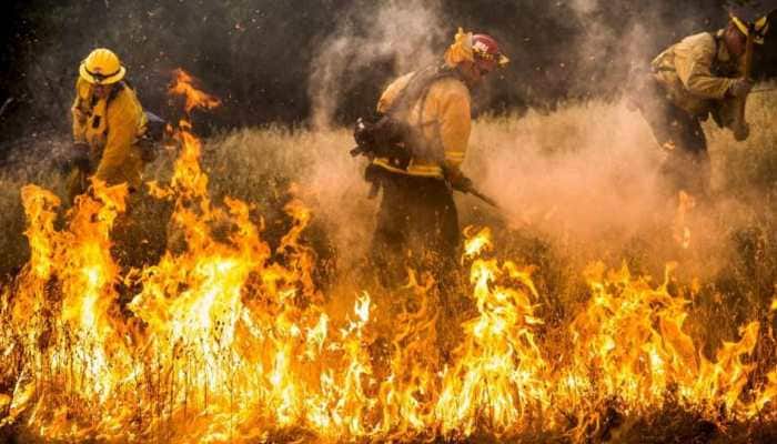 Death toll in massive California wildfire revised down by one