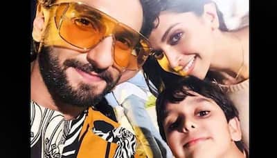 Deepika Padukone and Ranveer Singh pose with a little fan; netizens want them to have a baby asap!