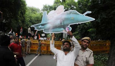 CAG report on Rafale deal tabled even as Congress leaders fly paper planes outside Parliament 