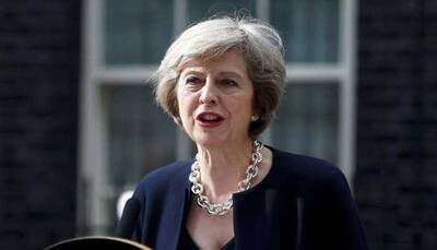 British PM Theresa May signals she is ready to fight on