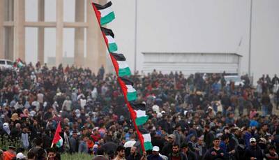 Palestinians mass at Gaza border to mark protest anniversary