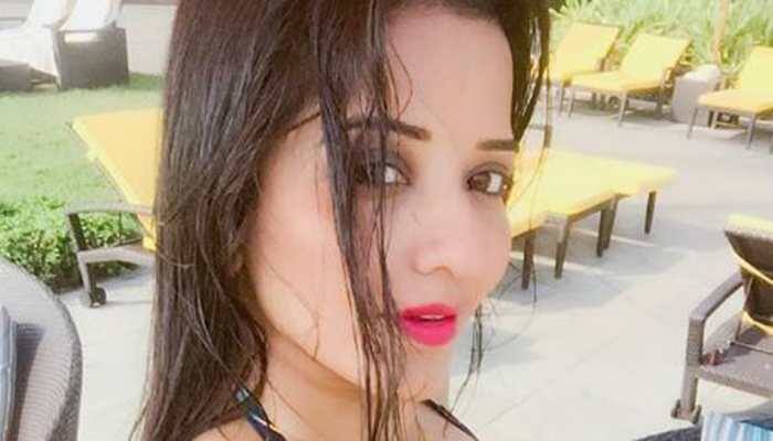 Monalisa sets the temperature soaring in a multi-coloured swimsuit-See pic