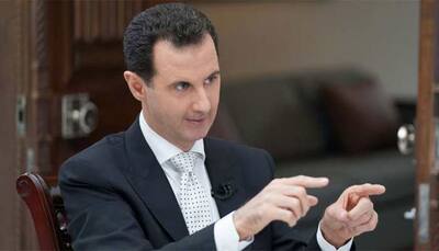 Syria's Assad discusses peace talks, trade with Russian envoys