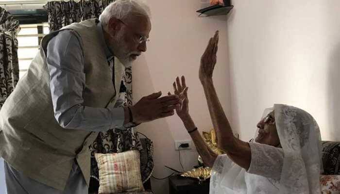 PM Modi meets his mother to take her blessings before casting vote in Ahmedabad