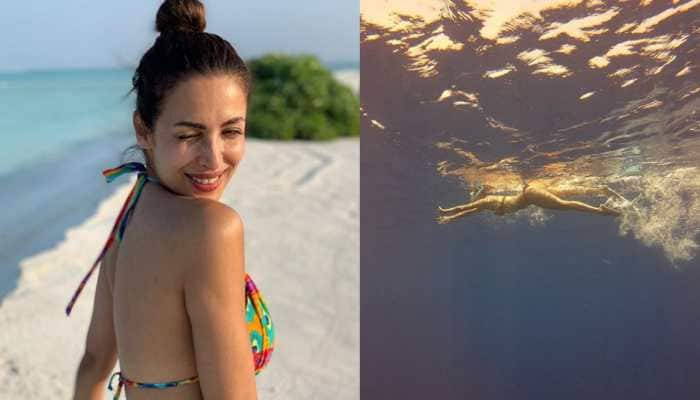 Malaika Arora turns water baby, raises the mercury in a red bikini—Pics