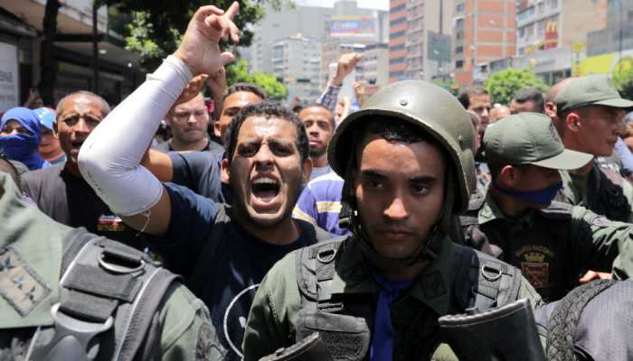 Violence-hit Venezuela on the edge as Opposition leader wants troops to unite against President Maduro