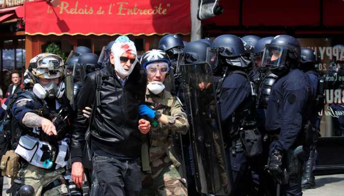 Riot police, masked protesters clash at Paris May Day rally