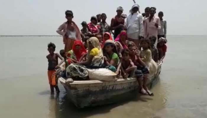 In pics: Voters in Uttar Pradesh's Sitapur cross rivers to reach polling booths