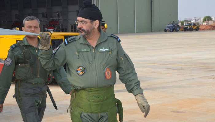 IAF Chief Birender Singh Dhanoa visits Sulur air base, inspects Tejas, flies &#039;formidable war machine&#039; MiG-21