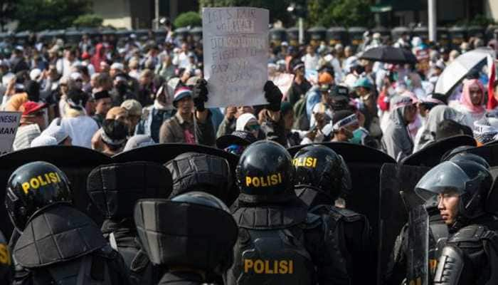 Six die, protests swell as Indonesia plunges into post-election unrest