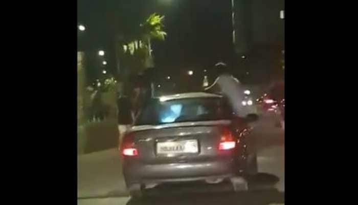 Watch: 3 youngsters perform stunt in a moving car in Mumbai, arrested