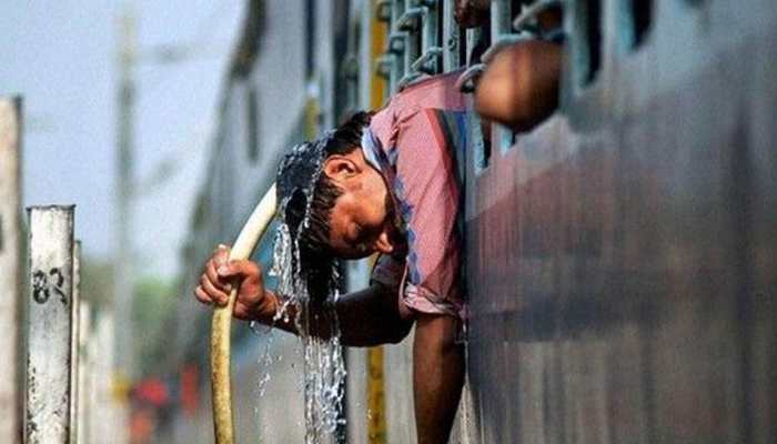 Delhi continues to grapple with heatwave, IMD issues &#039;red&#039; warning