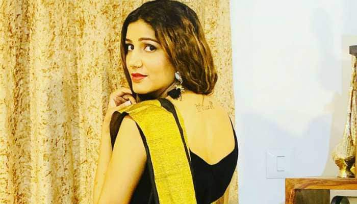 &#039;Desi queen&#039; Sapna Choudhary&#039;s pics in a black sari are breaking the internet - Take a look