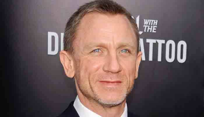 Daniel Craig sweats it out with leg cast following injury on sets of 'Bond 25'