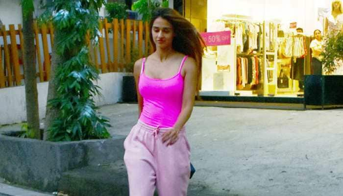 Disha Patani&#039;s steps out in a striking neon pink spaghetti top and casual pants - Pics