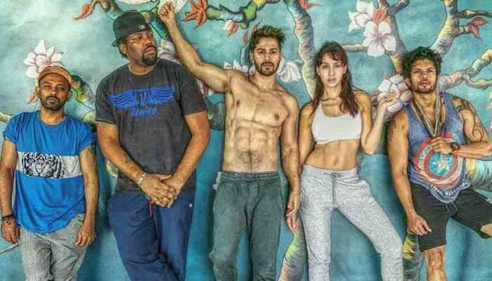 Varun Dhawan, Nora Fatehi show off abs in new still from 'Street Dancer' sets