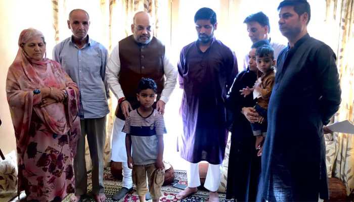 Amit Shah first HM to visit Jammu and Kashmir Police martyr&#039;s home, offers job to wife