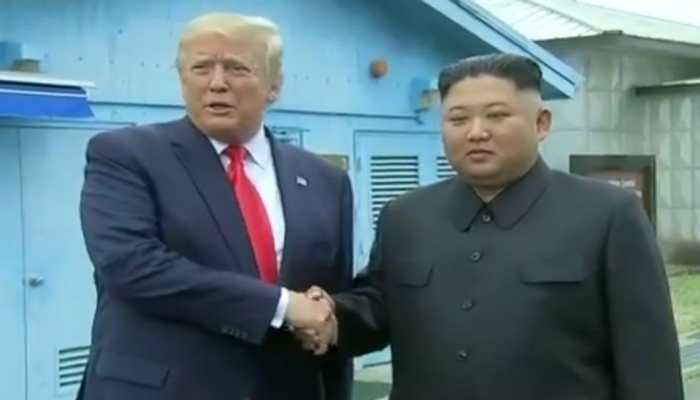 In historic first, Donald Trump meets Kim Jong-un and steps into North Korea