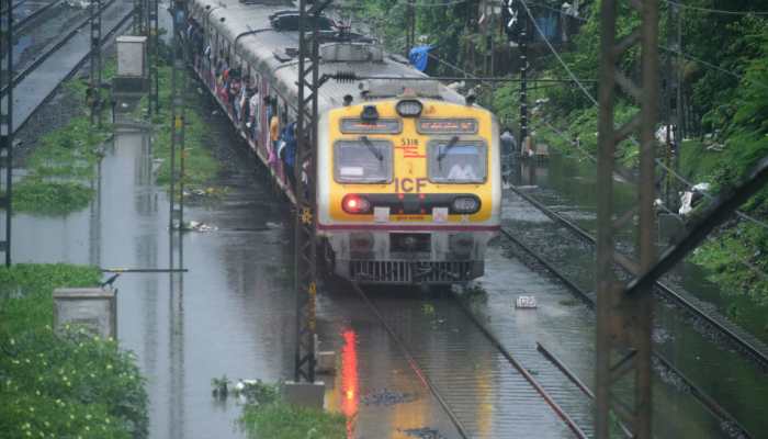 Mumbai Local Trains Face Rain Fury Several Trains Cancelled Diverted India News Zee News