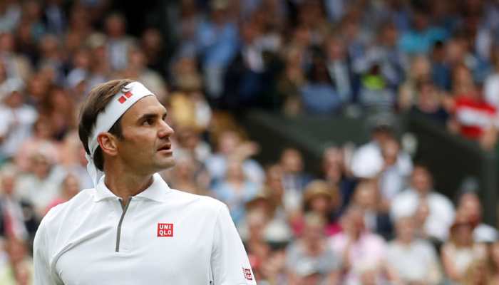 Roger Federer survives first-set wobble to down Wimbledon debutant