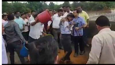 Congress MLA Nitesh Rane throws mud on highway engineer, ties him to bridge
