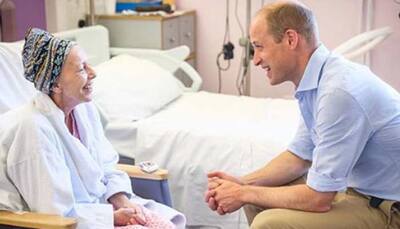 Prince William gives out hugs during a visit to Royal hospital