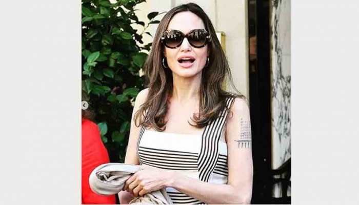 Angelina Jolie turns heads in striped dress at Paris