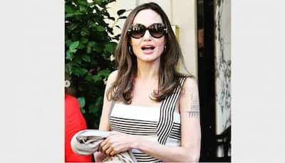 Angelina Jolie turns heads in striped dress at Paris