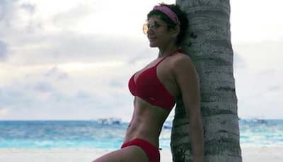 Mandira Bedi raises the temperature in a red bikini-See pic