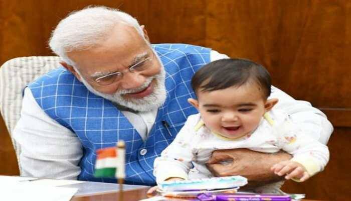 Photos of PM Narendra Modi playing with baby in Parliament go viral