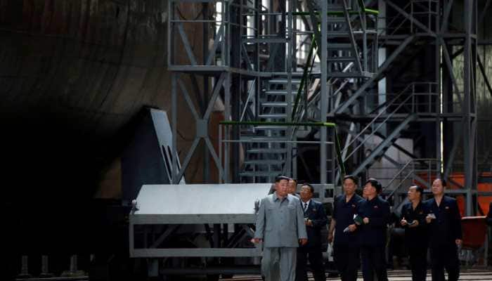North Korean leader Kim Jong Un inspects new submarine, signals possible ballistic missile development