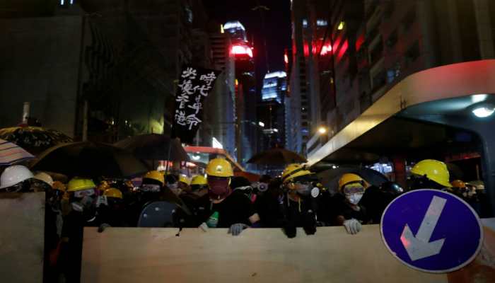 China urges end to Hong Kong protests, backs regional leader
