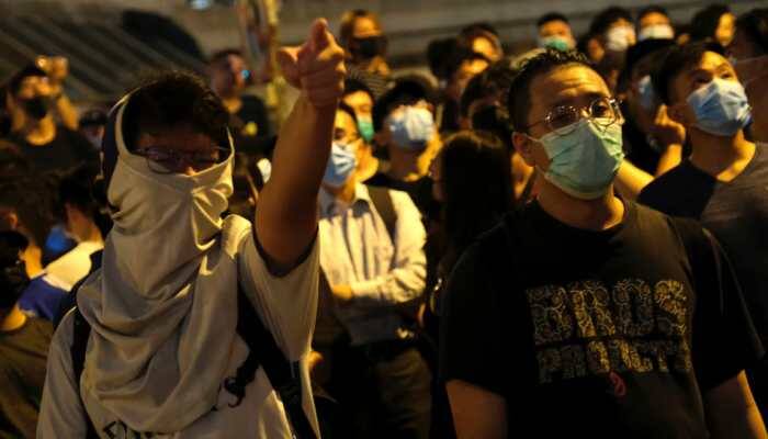 New protest erupts as Hong Kong charges 44 activists with rioting