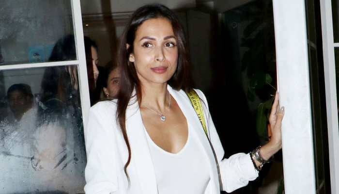 Malaika Arora looks uber chic in a top with plunging neckline—Pics 