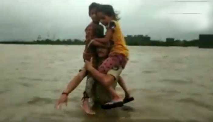 Watch: Brave constable Pruthviraj Jadeja carries two children on shoulders for 1.5 km in flood-hit Gujarat village