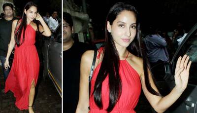 Nora Fatehi slays in a ravishing red gown with a slit—Photos