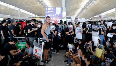 China says Hong Kong protests show ‘sprouts of terrorism’; airport reopens