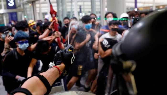 Hong Kong airport reopens after overnight clashes, hundreds of flights rescheduled