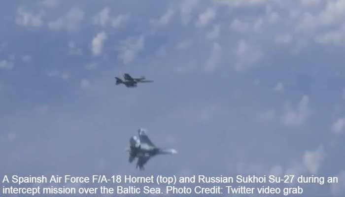 Sukhoi Su-27 fighters chase away Spanish Air Force F/A-18 Hornet as it tries to intercept Russian Defense Minister Sergei Shoigu's plane
