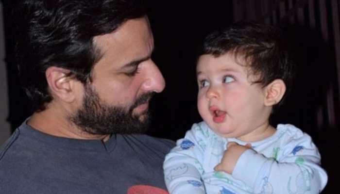 Taimur Ali Khan cannot stop laughing as dad Saif Ali Khan lifts him from the ground-See pic Taimur Ali Khan cannot stop laughing as dad Saif Ali Khan lifts him from the ground-See pic